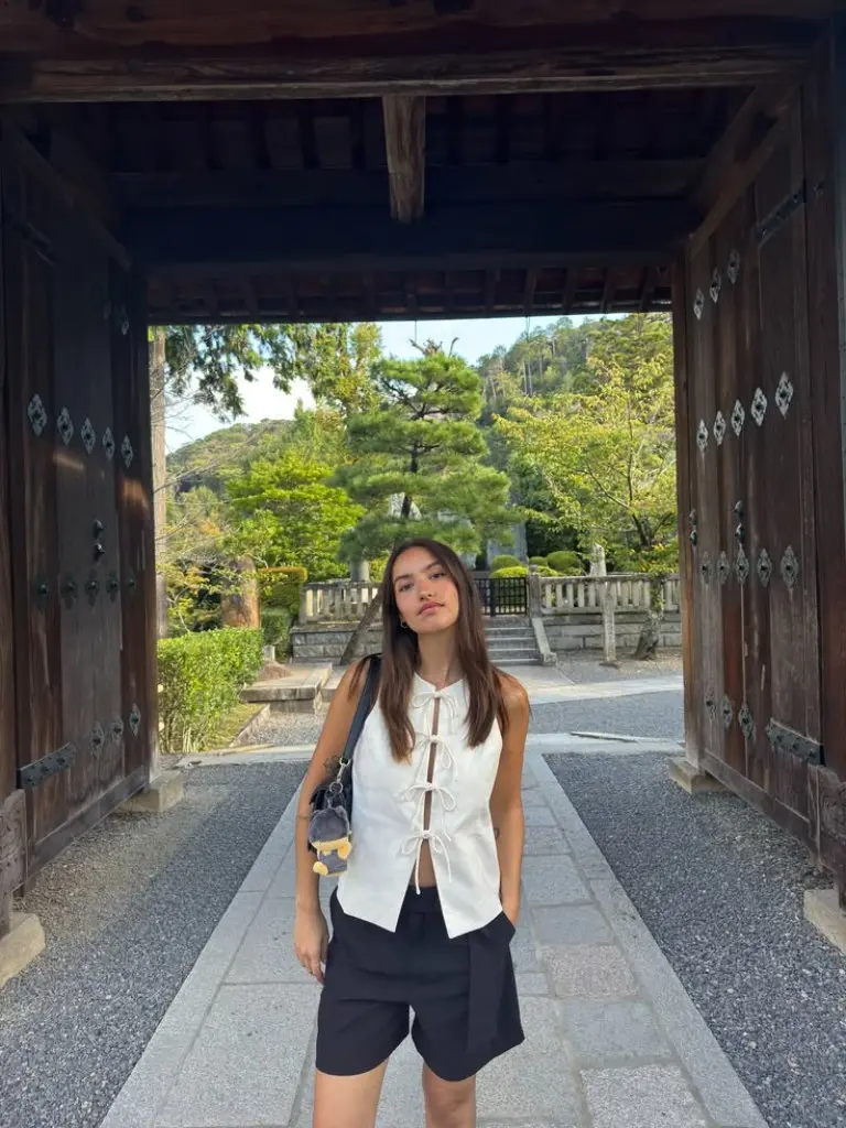 white linen tie front shirt black bermuda shorts brown leather crossbody bag traditional garden outfit 9
