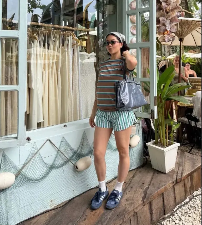 oversized striped t-shirt green striped shorts navy sneakers silver tote bag beachside outfit 11