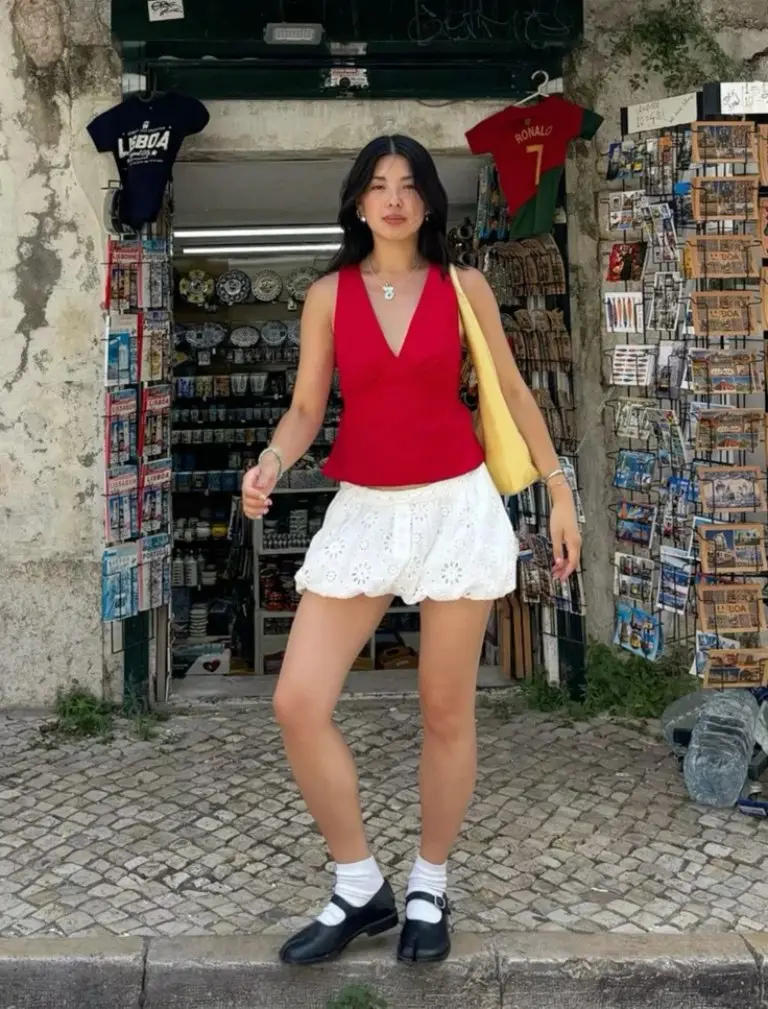 red sleeveless v-neck top white eyelet mini skirt black strappy sandals yellow canvas bag cobblestone outfit 12