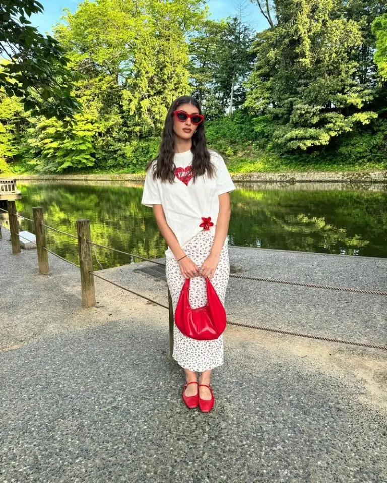 white t-shirt with red bandana print white polka dot midi skirt red mary jane shoes red structured handbag pop culture outfit 17