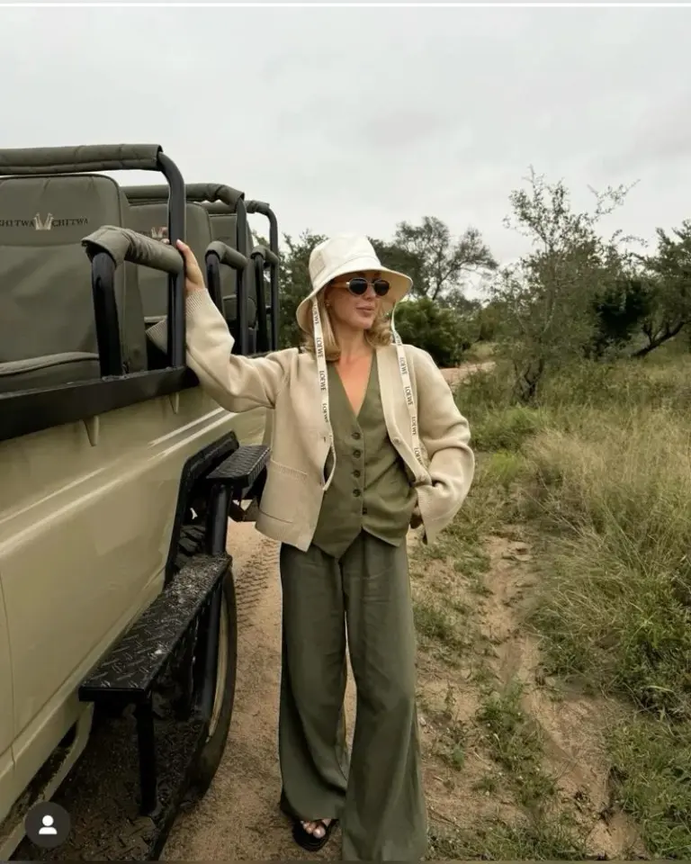beige blazer olive jumpsuit cream safari hat sunglasses open vehicle outfit 6