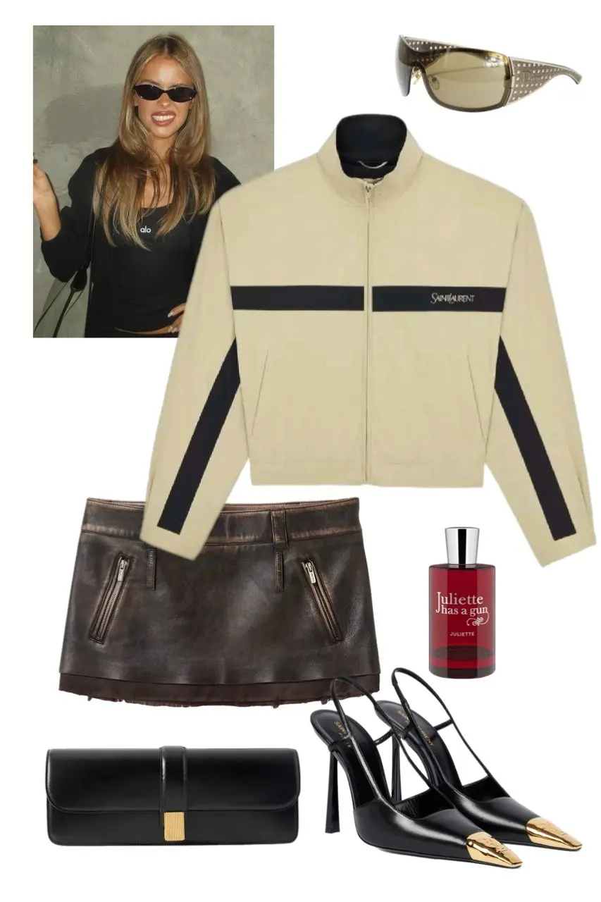 Y2K outfit flat lay with Saint Laurent cream track jacket, distressed brown leather mini skirt, black slingback heels with gold toe, black clutch, rhinestone shield sunglasses, and Juliette Has a Gun perfume, outfit 1