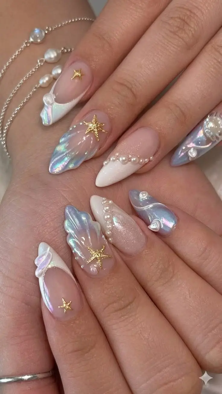 medium almond nails with iridescent chrome shell relief art sheer nude base pearl chain swag and gold star charm accents photo 5