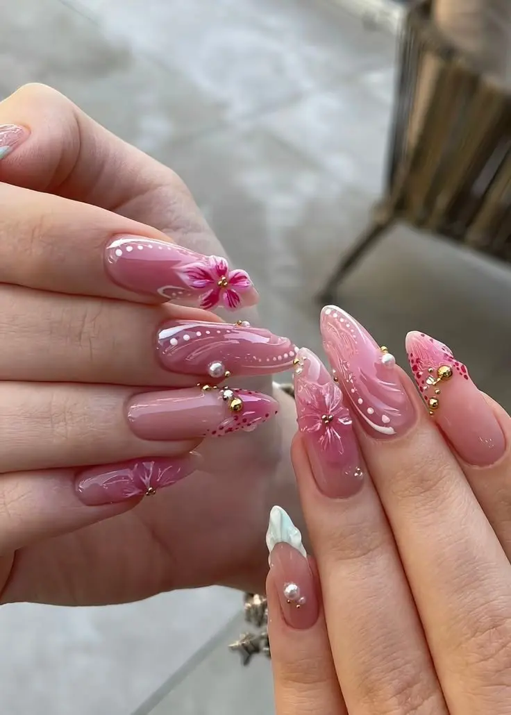 medium long almond dusty rose nails with sculpted 3D pink flower pearl swirls gold micro-beads floral linework and white angel wing French tip photo 9