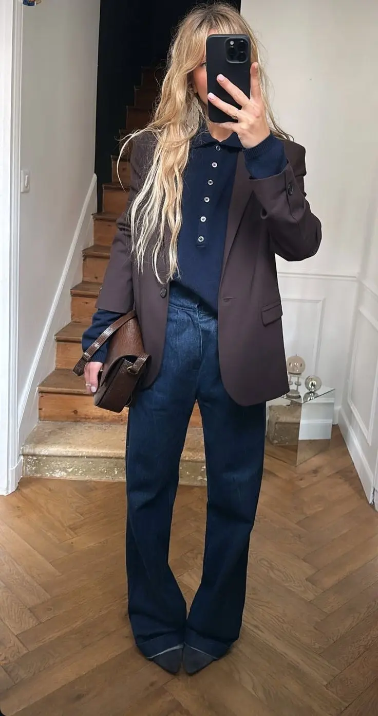 woman in dark brown oversized blazer navy polo knit sweater dark indigo wide leg jeans brown croc clutch bag dark heeled boots mirror selfie fall work outfit 2