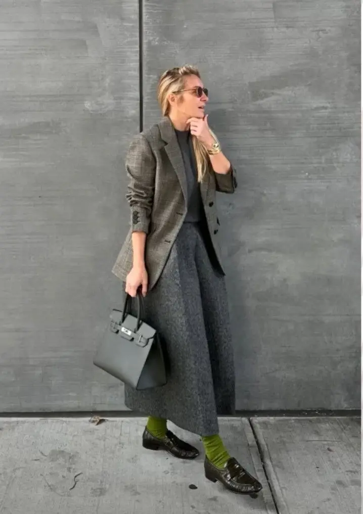 woman in grey plaid longline blazer grey turtleneck grey maxi skirt olive green socks dark croc loafers grey structured tote bag sunglasses gold bangle fall work outfit 6