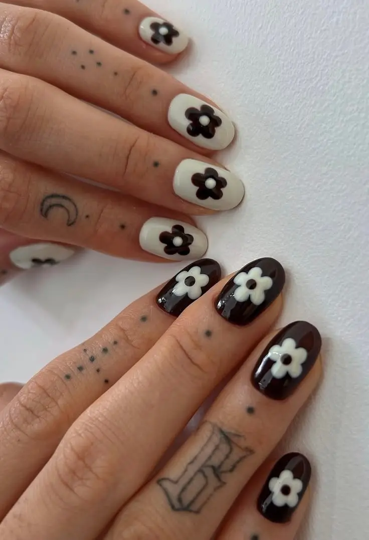 short oval nails alternating cream and dark espresso brown gel with large retro five-petal daisy in contrasting color on each nail photo 11
