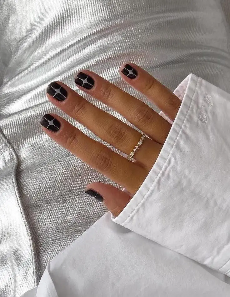 short square nails in dark espresso brown with white grid stained glass lines, silver ring, metallic silver fabric background, photo 1