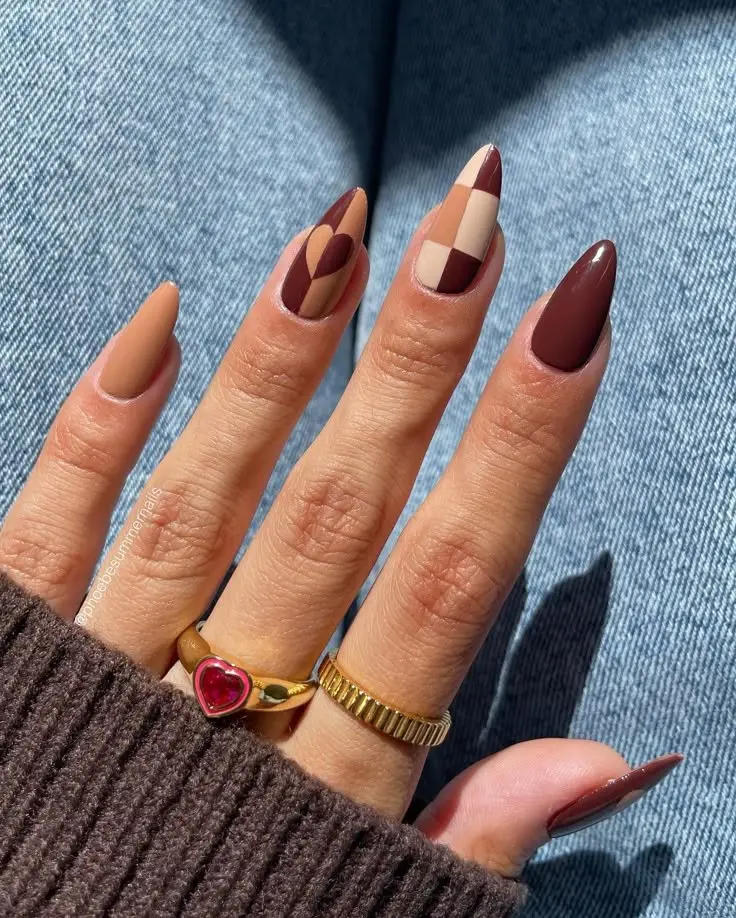 long almond nails with terracotta nude, deep burgundy, cream and burgundy checkerboard, and heart accent nail in earthy fall palette, photo 2
