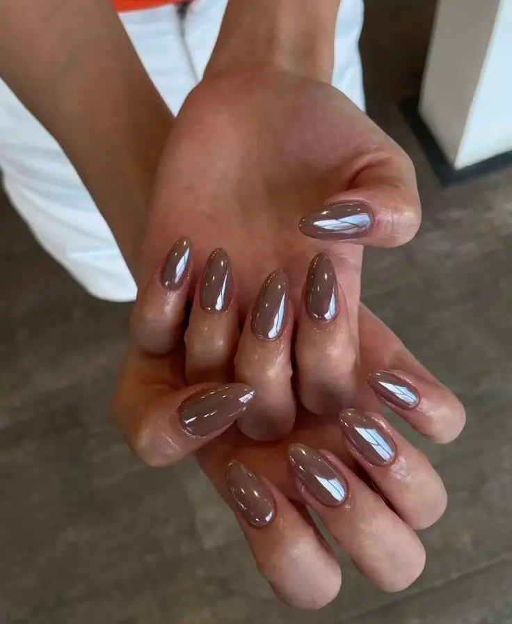 medium almond nails in warm greige taupe gel polish at high gloss finish on two hands, photo 9