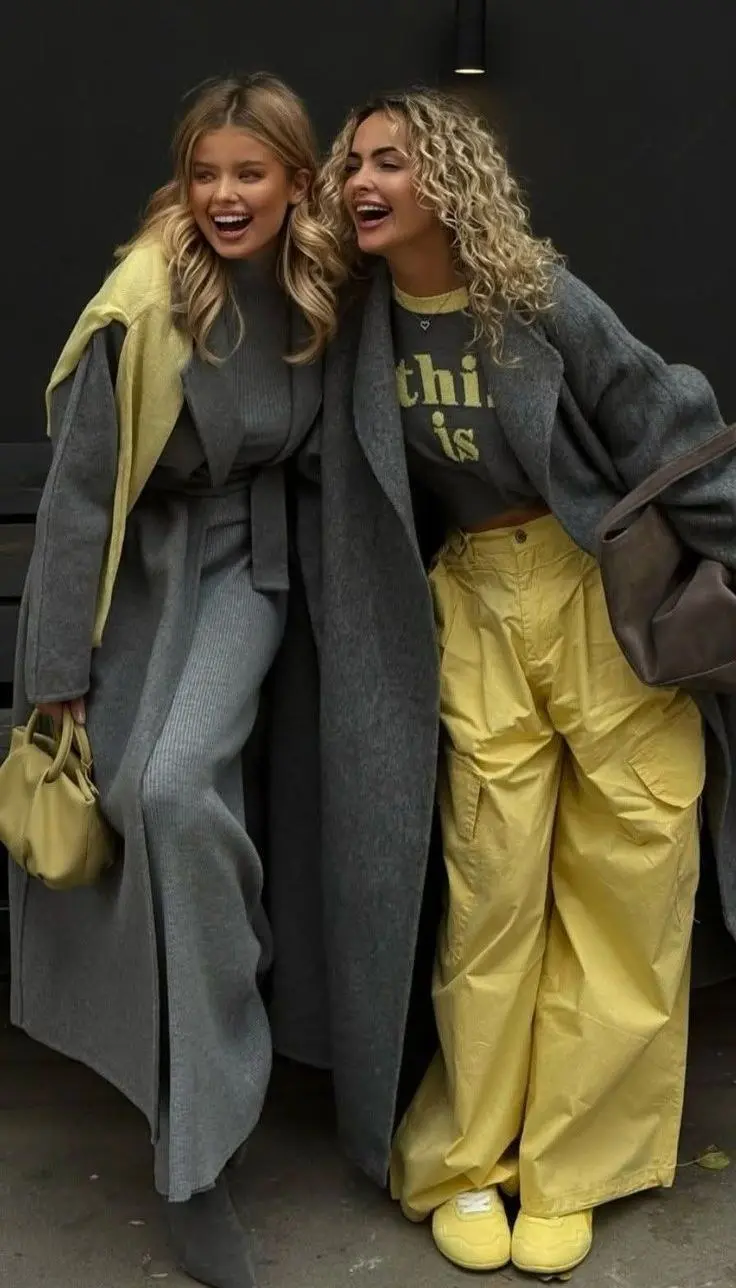 Wide-leg dark denim with patch pockets, oversized graphic tee half-tucked, platform sneakers, streetwear editorial