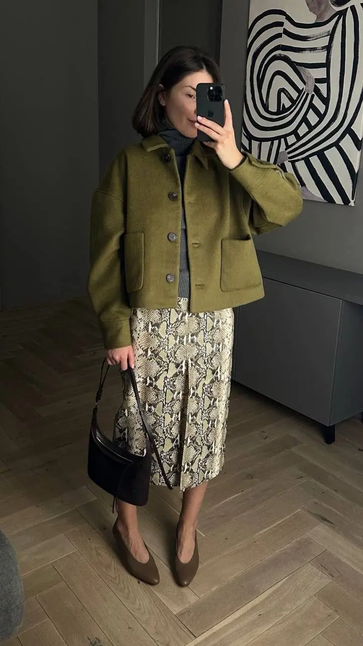 Zebra-striped ankle boots worn with wide-leg camel trousers and a white oversized shirt, editorial street style autumn