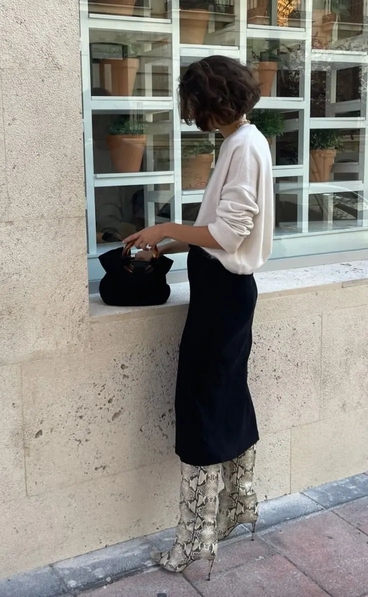 Full-length faux fur leopard coat over white tee and dark denim, bold street style statement, fashion week exterior