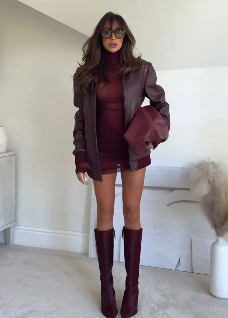 Oxblood leather bag and matching suede boots as accent against a camel monochrome outfit, fall street style