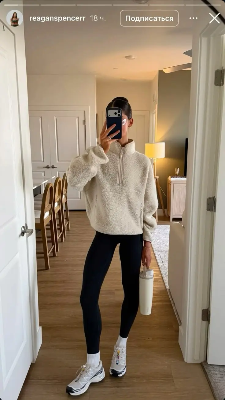 woman in cream sherpa fleece half zip pullover black full length leggings white ankle socks white salomon sneakers mirror selfie hallway outfit 17