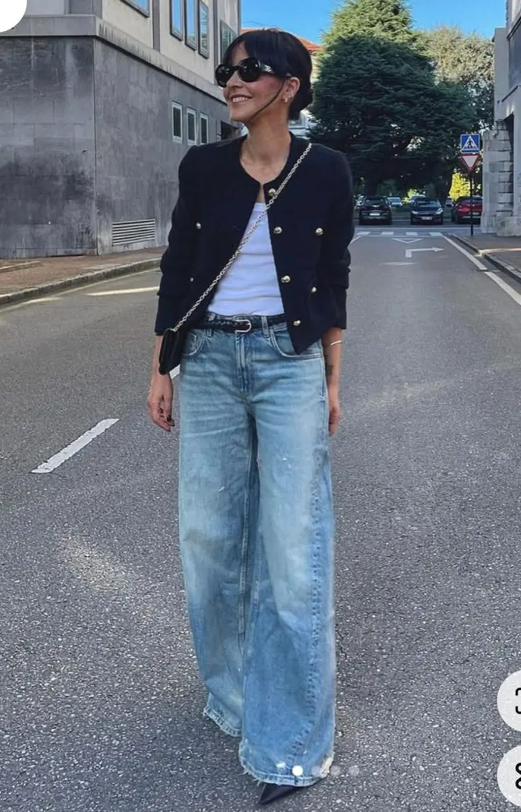 woman in black tweed gold button blazer white fitted tank top light wash wide leg jeans slim black belt black pointed kitten heels black chain crossbody bag sunglasses street outfit 19