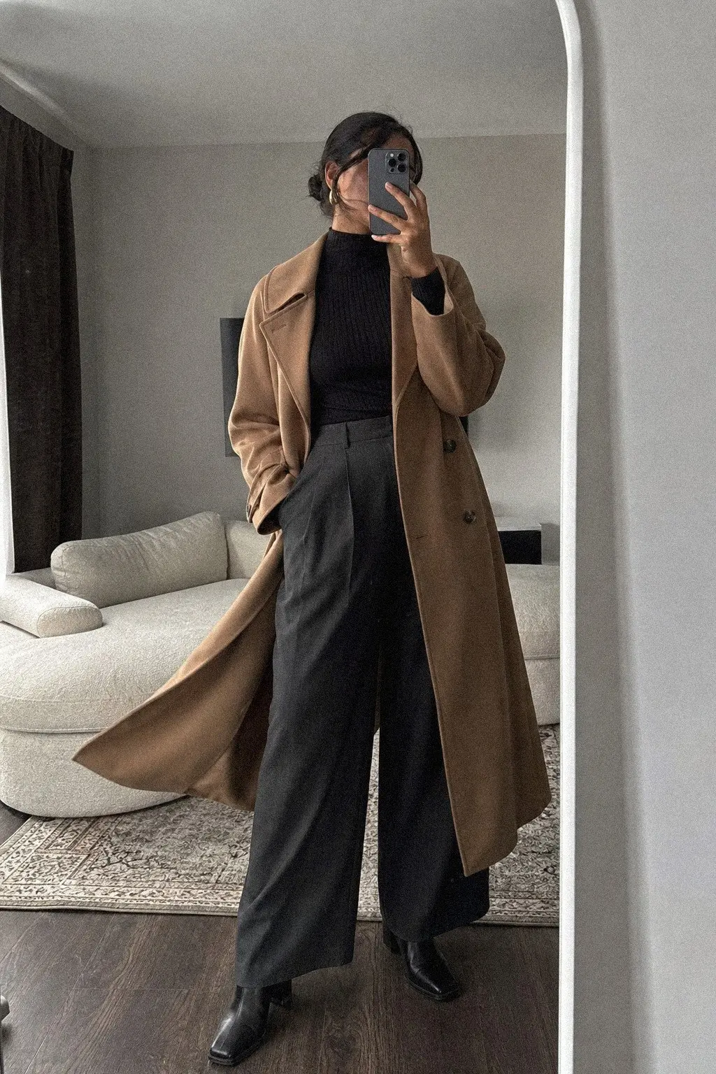 camel trench coat slim black turtleneck wide-leg charcoal trousers block heel ankle boots fall work outfit photo 1