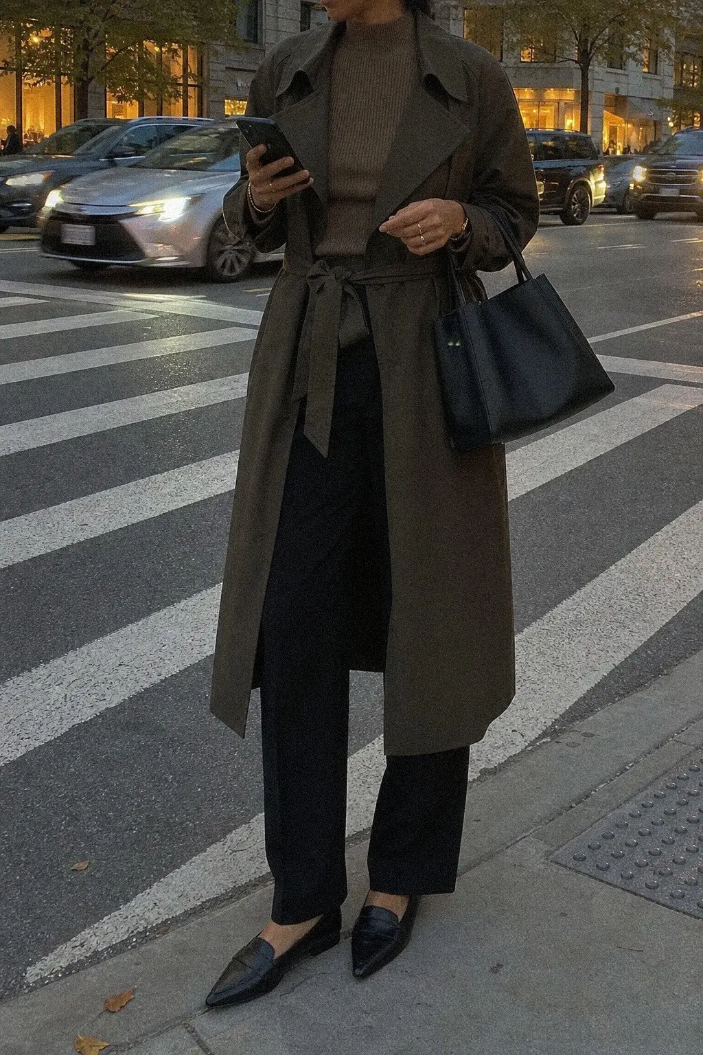 olive trench coat ribbed camel mock-neck straight black trousers black pointed loafers fall work outfit photo 6