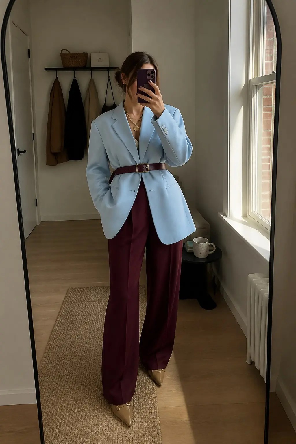powder blue oversized blazer burgundy wide leg tailored trousers burgundy leather belt camel pointed toe heels gold layered necklace outfit 1