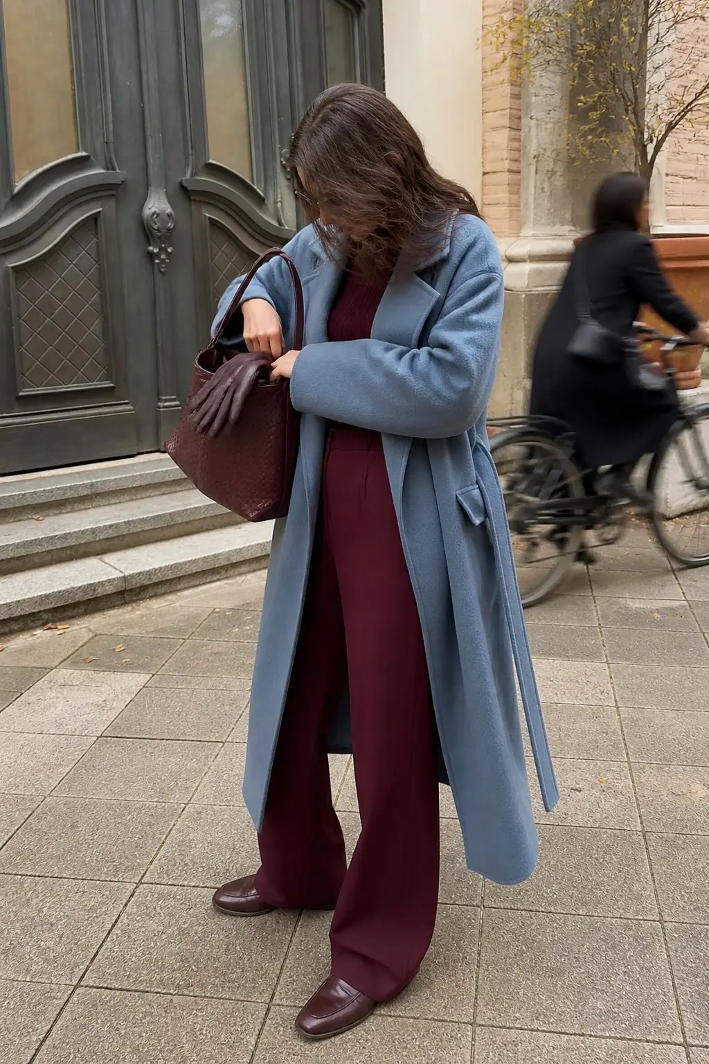 slate blue longline wool coat burgundy ribbed knit top burgundy wide leg trousers large burgundy woven leather hobo bag burgundy leather loafers outfit 7