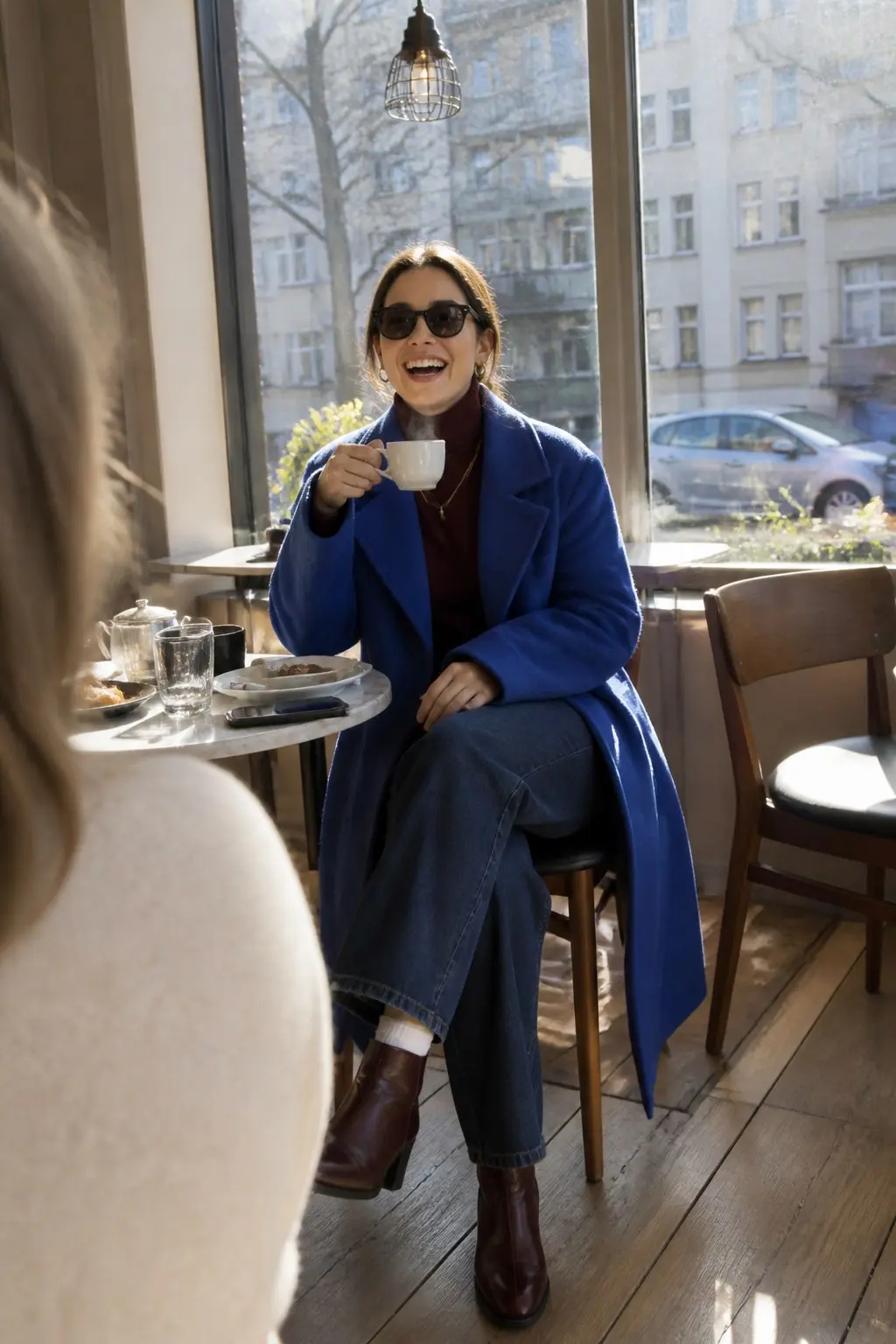 cobalt blue wool coat burgundy turtleneck dark wash wide leg jeans dark burgundy ankle boots white visible socks outfit 10