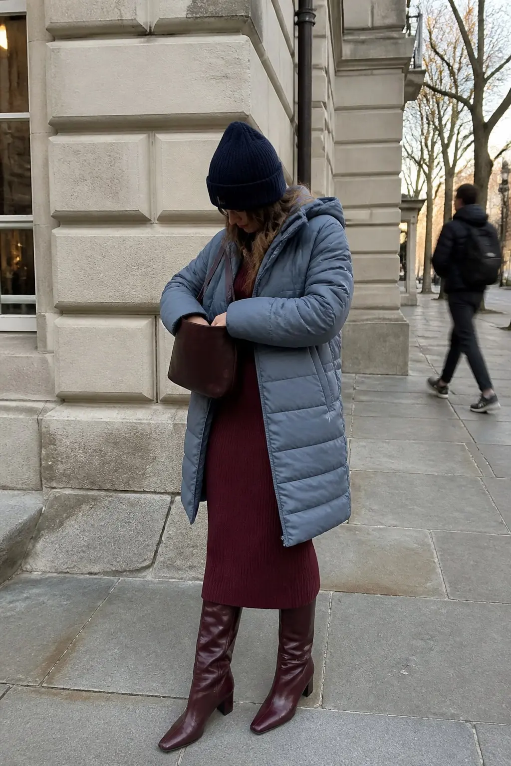 steel blue longline quilted puffer jacket burgundy ribbed knit midi dress burgundy knee high heeled boots navy ribbed beanie small burgundy leather bucket bag outfit 15