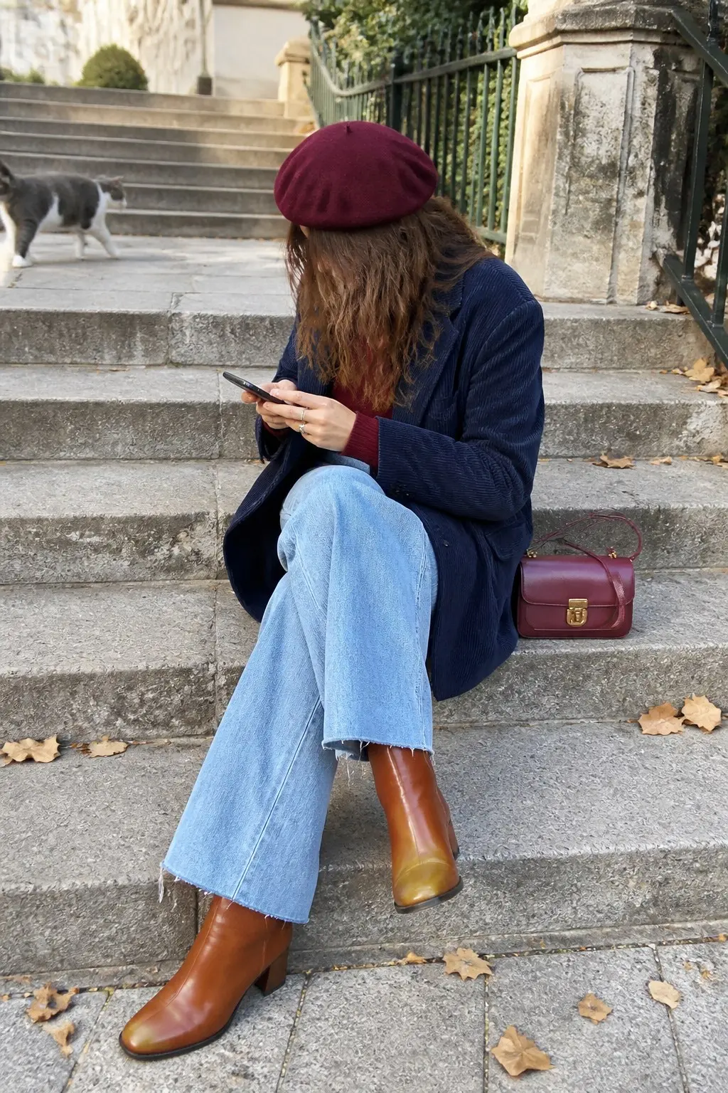 navy blue corduroy blazer burgundy ribbed sweater light blue wide leg raw hem jeans burgundy beret tan leather ankle boots burgundy top handle crossbody bag outfit 18