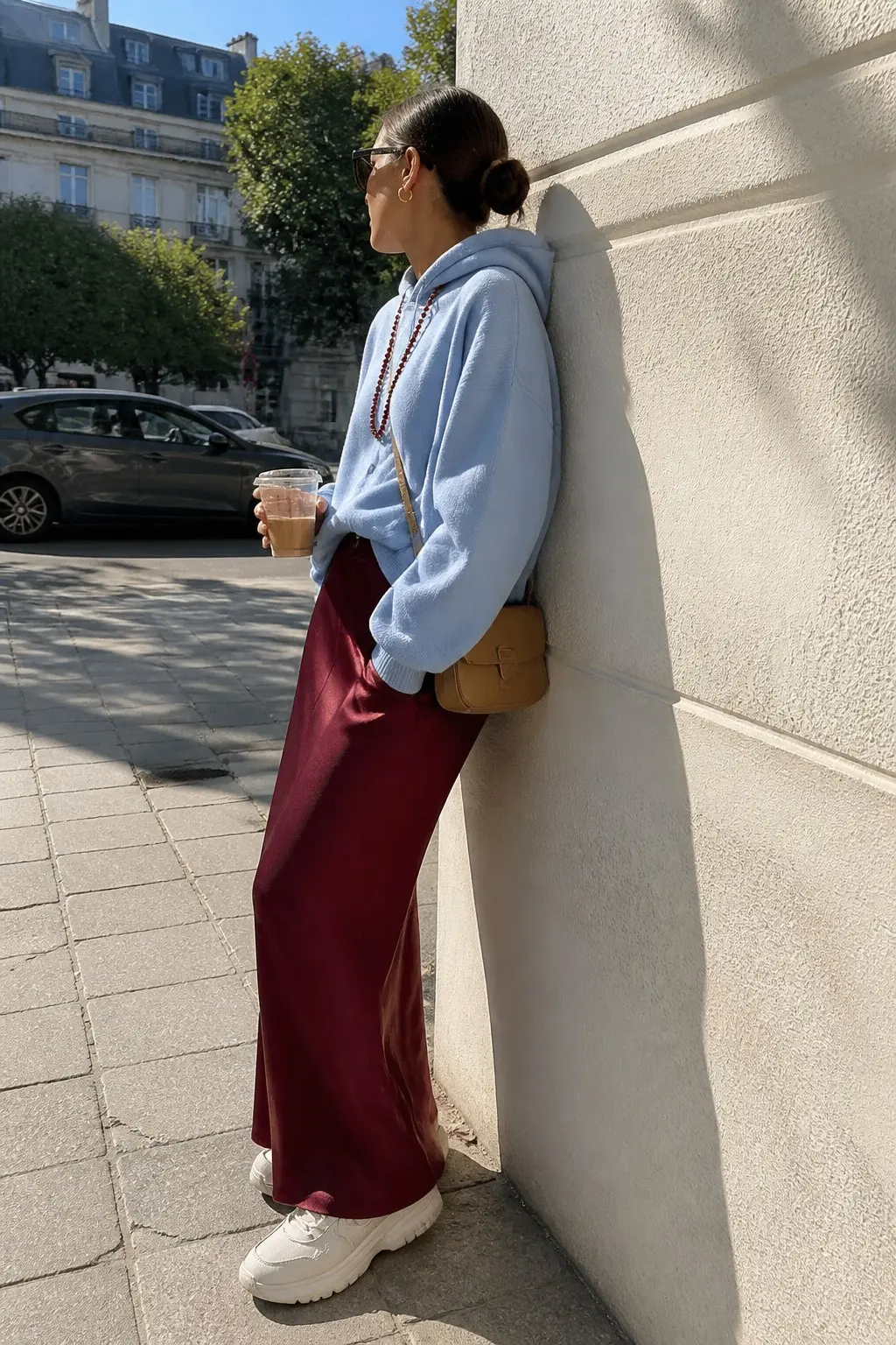 powder blue oversized hoodie burgundy fluid maxi skirt white chunky sneakers tan structured crossbody saddle bag burgundy beaded long necklace outfit 30