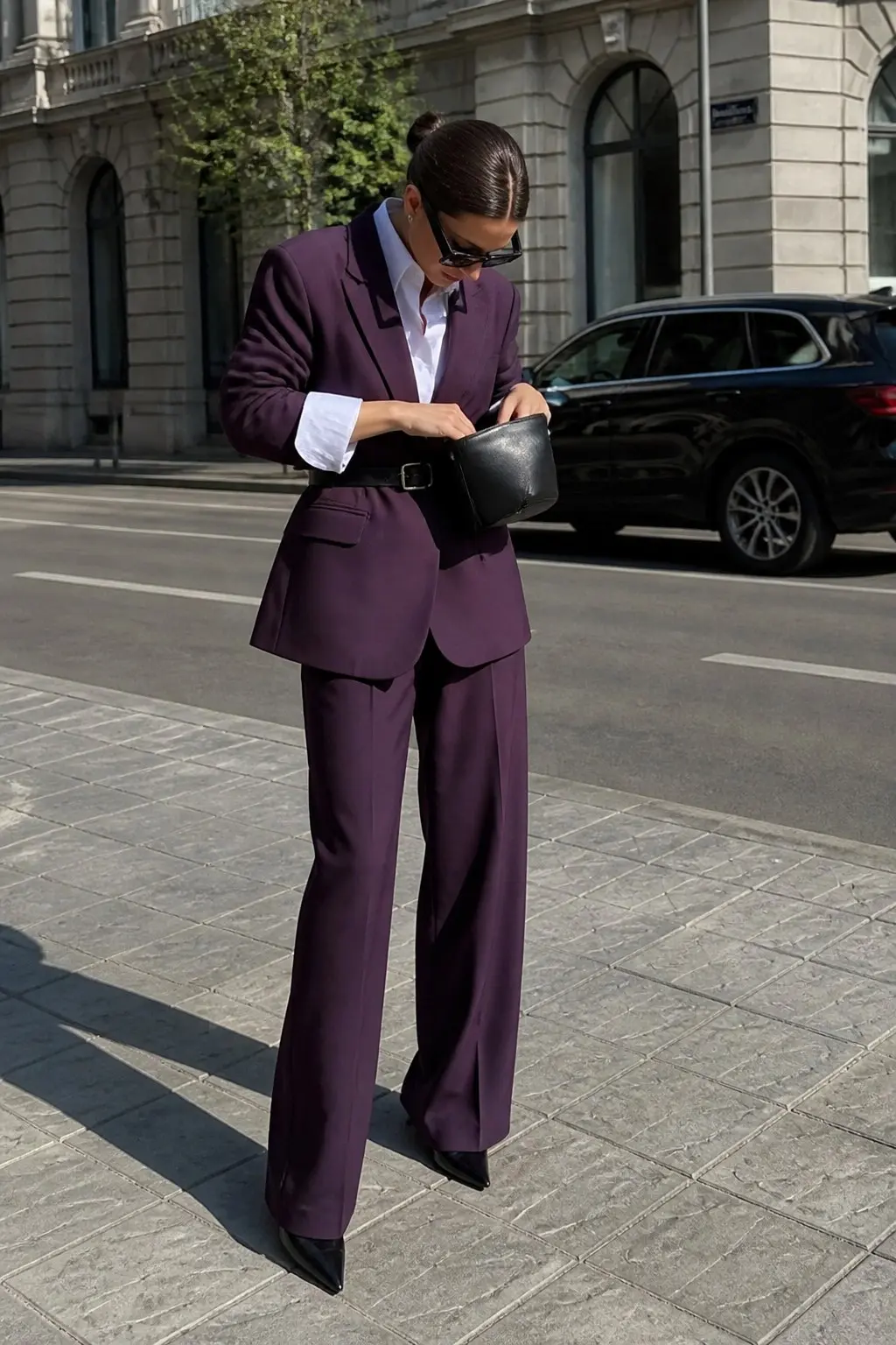 deep purple oversized blazer matching deep purple wide-leg trousers suit white shirt black belt black leather clutch bag black pointed pumps black sunglasses outfit 19