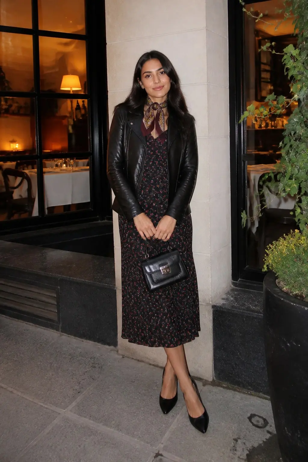 dark black ground floral midi dress black leather biker jacket printed silk scarf tied at neck small structured black leather crossbody bag black pointed toe pumps outfit 17