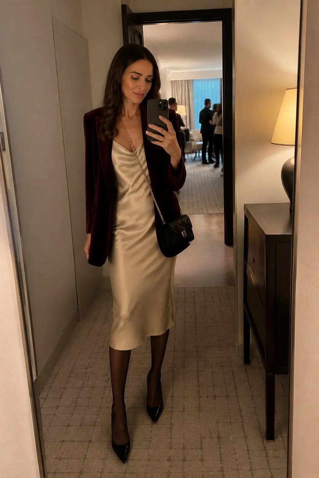 champagne satin cowl neck slip midi dress burgundy velvet blazer black sheer tights black pointed pumps small black quilted crossbody bag gold chain strap outfit 20