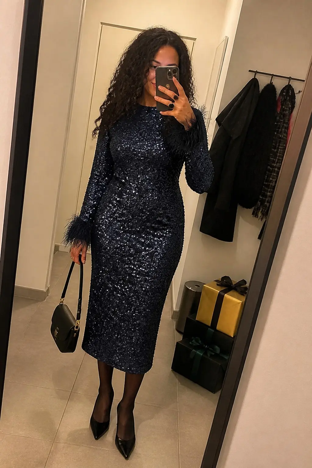 navy blue sequin long sleeve midi dress feather trim cuffs black sheer tights black patent pointed pumps small black top handle bag outfit 26