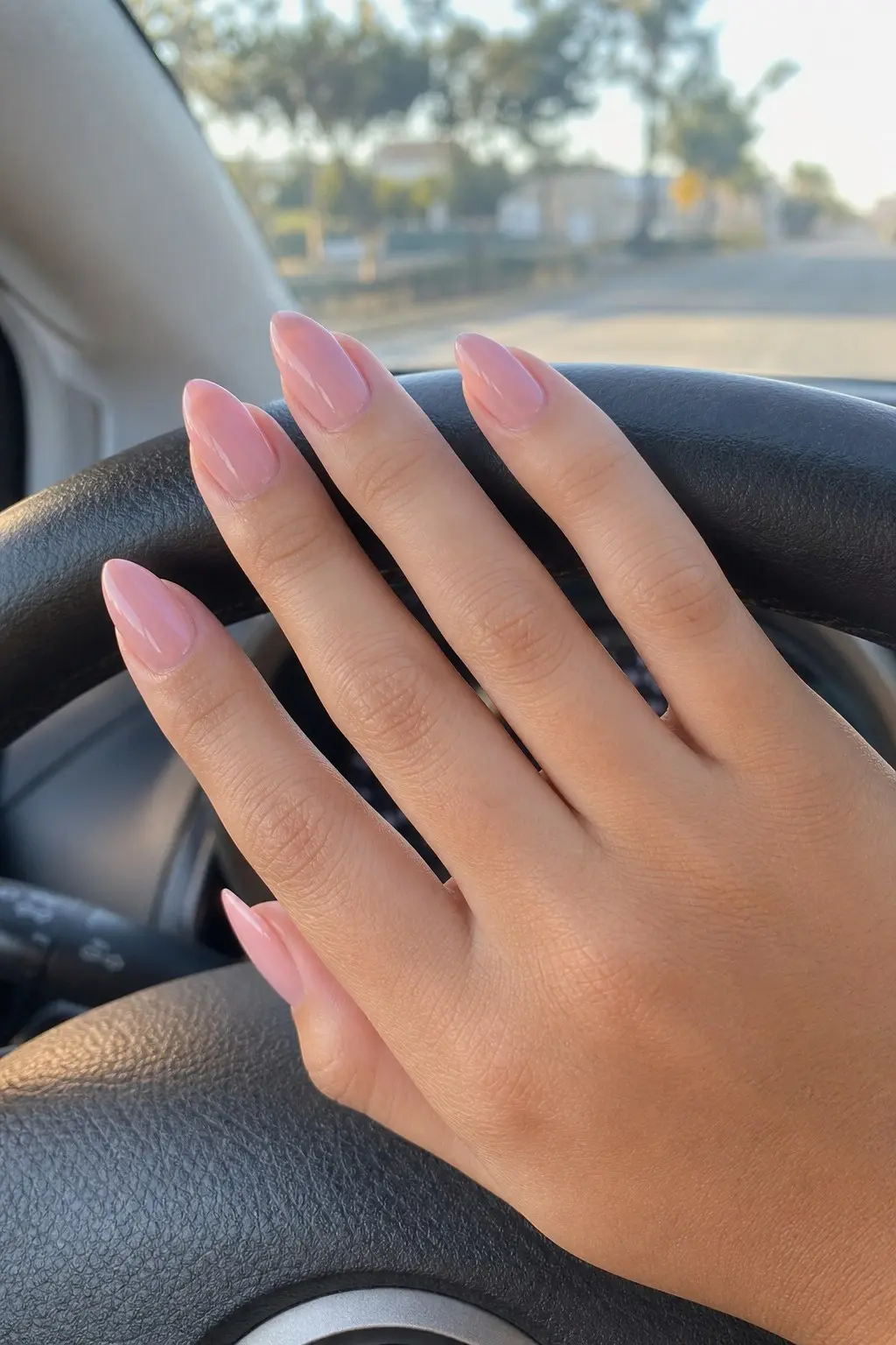 medium-long almond nails with solid light pink gel base, no nail art, glossy finish, nail look 14