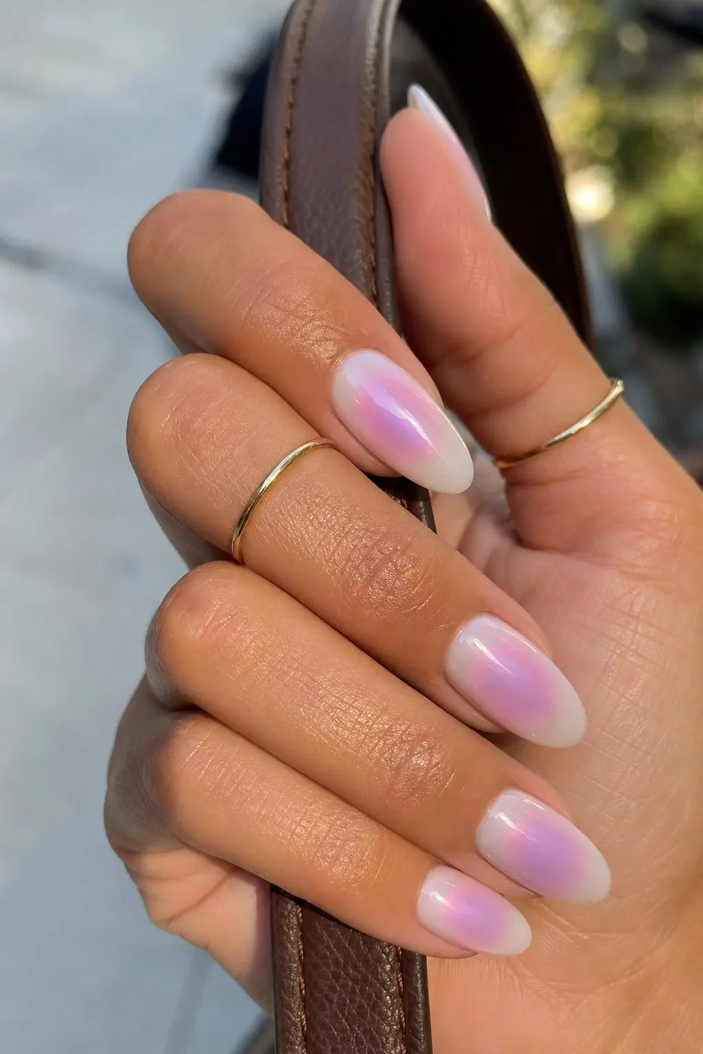 medium almond nails with sheer white base and pink purple iridescent aura chrome diffusing from center of each nail, all nails uniform, nail look 30