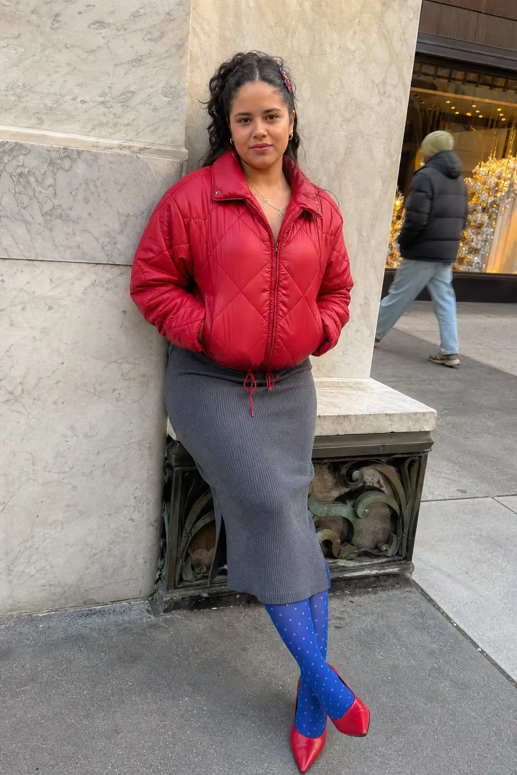 woman in red quilted zip puffer jacket gray ribbed knit midi skirt blue polka dot opaque tights red pointed toe pumps outfit 18