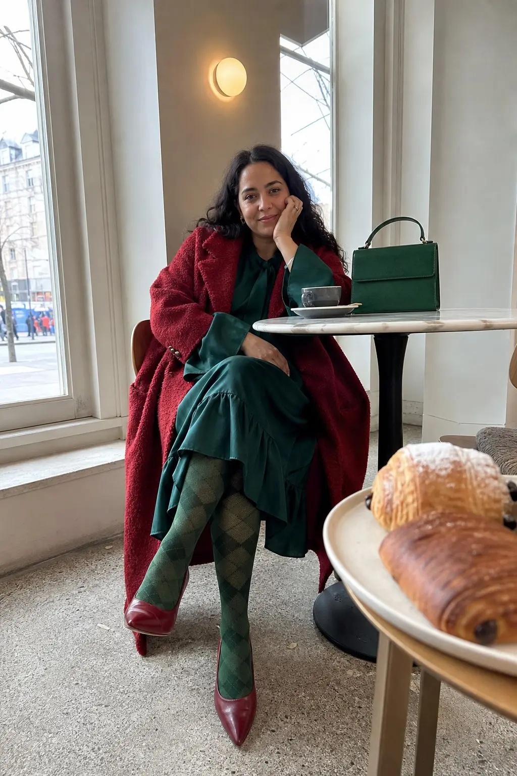woman in oversized dark red teddy coat emerald green bow neck midi dress green argyle tights dark red pointed toe pumps small emerald green top handle bag outfit 22