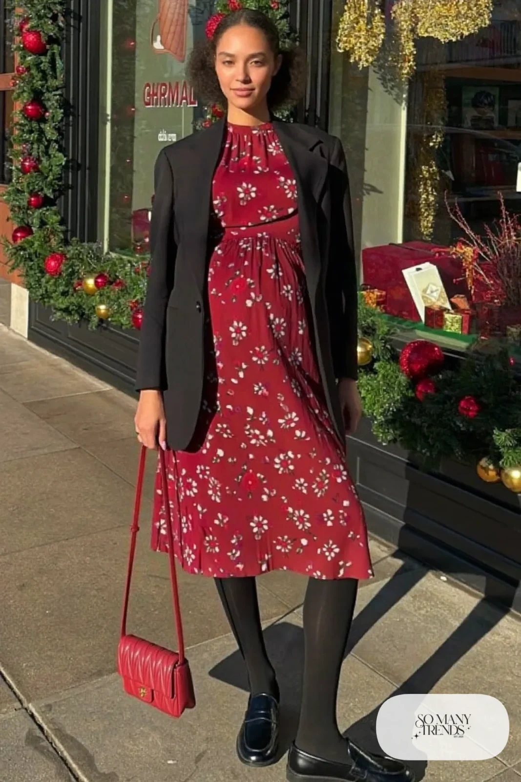 pregnant woman in cranberry floral midi dress, black oversized blazer, black tights, black loafers, red quilted crossbody bag, outfit 14