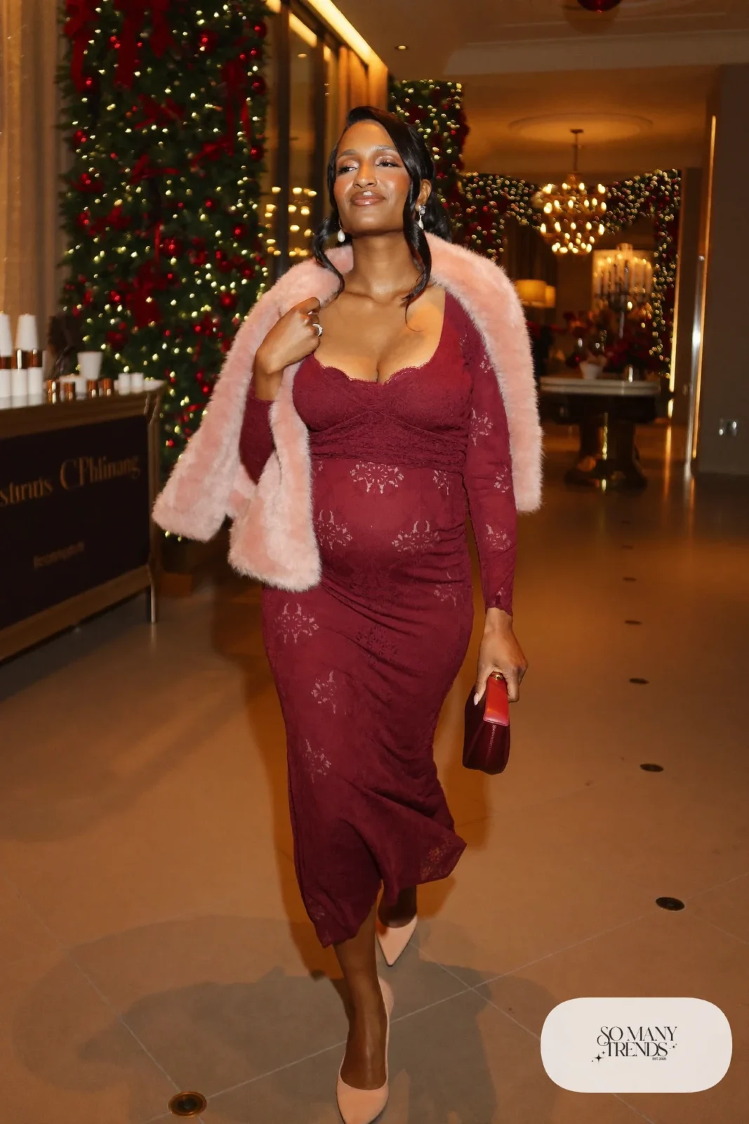 pregnant woman in wine lace long sleeve midi dress, blush faux fur stole on shoulders, nude kitten heel closed toe pumps, small burgundy satin clutch, pearl earrings, outfit 29