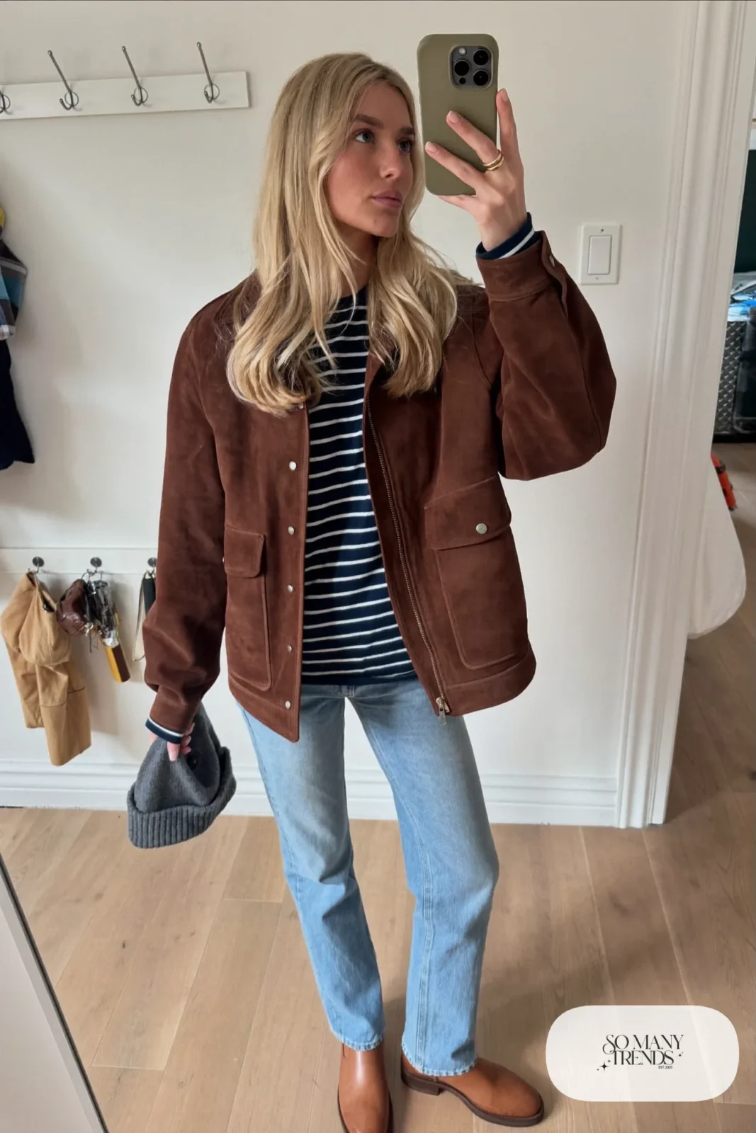 chocolate brown suede jacket navy striped top light wash jeans tan boots beanie outfit 5