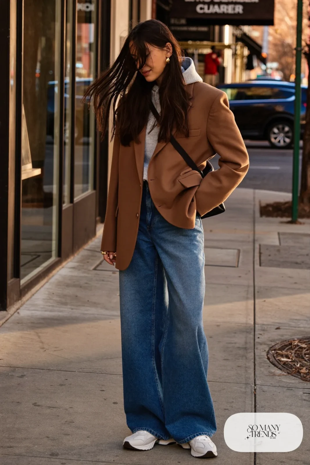 camel blazer grey hoodie wide-leg mid blue jeans white chunky sneakers crossbody bag outfit 11