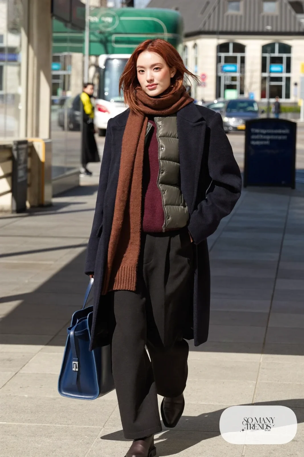 charcoal slim puffer vest under navy wool coat burgundy knit wide black trousers black boots outfit 15