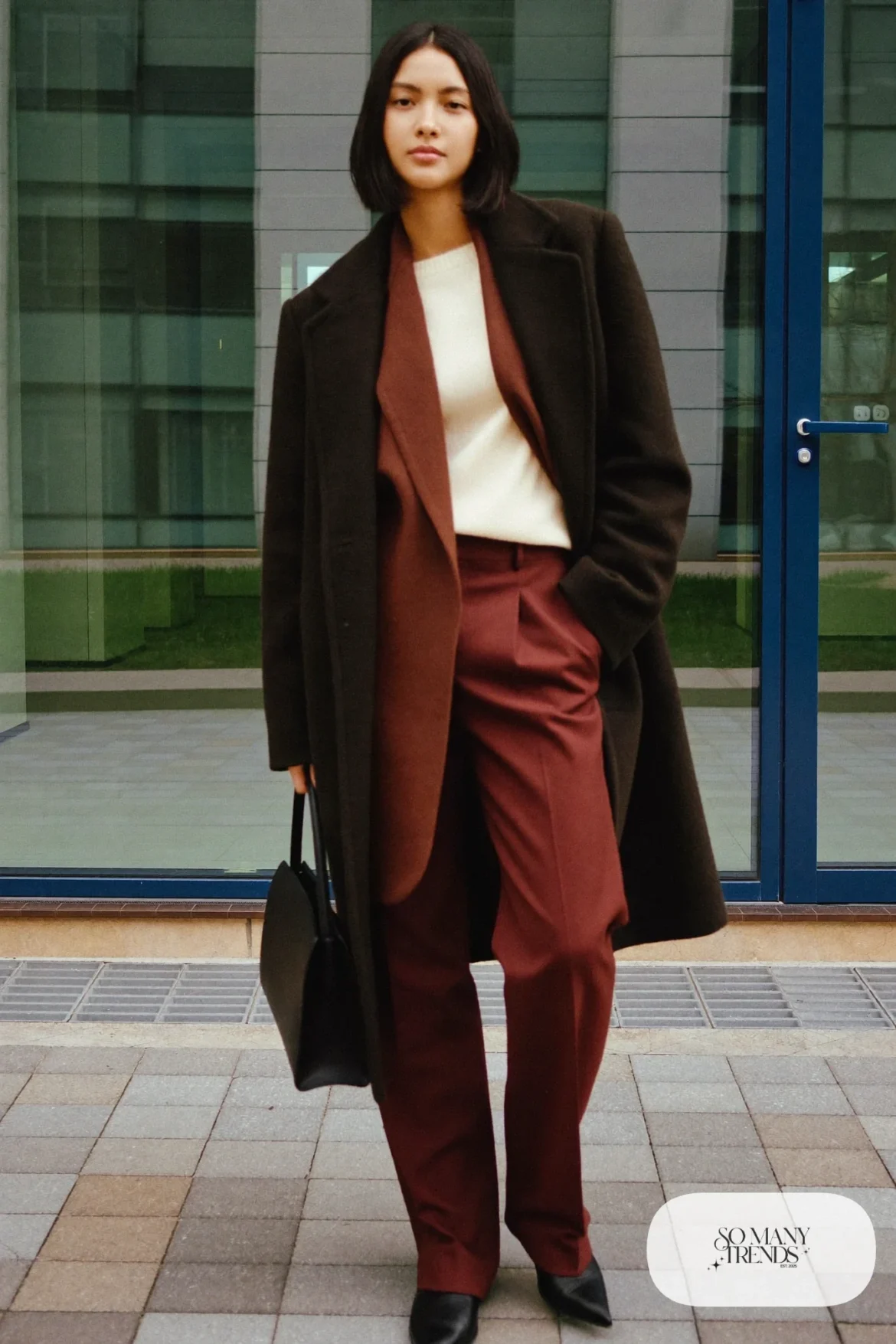 black wool coat cream knit sweater burgundy straight trousers black pointed boots structured bag outfit 18