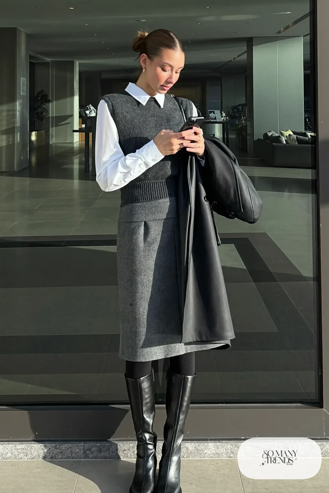 charcoal knit vest white shirt grey wool midi skirt opaque tights tall black boots long black coat outfit 21