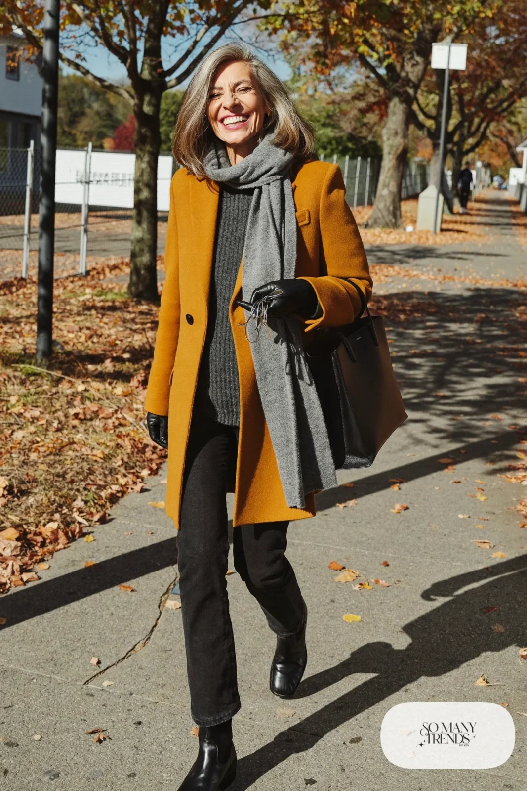 mustard wool coat charcoal knit sweater black jeans grey scarf black gloves boots outfit 3