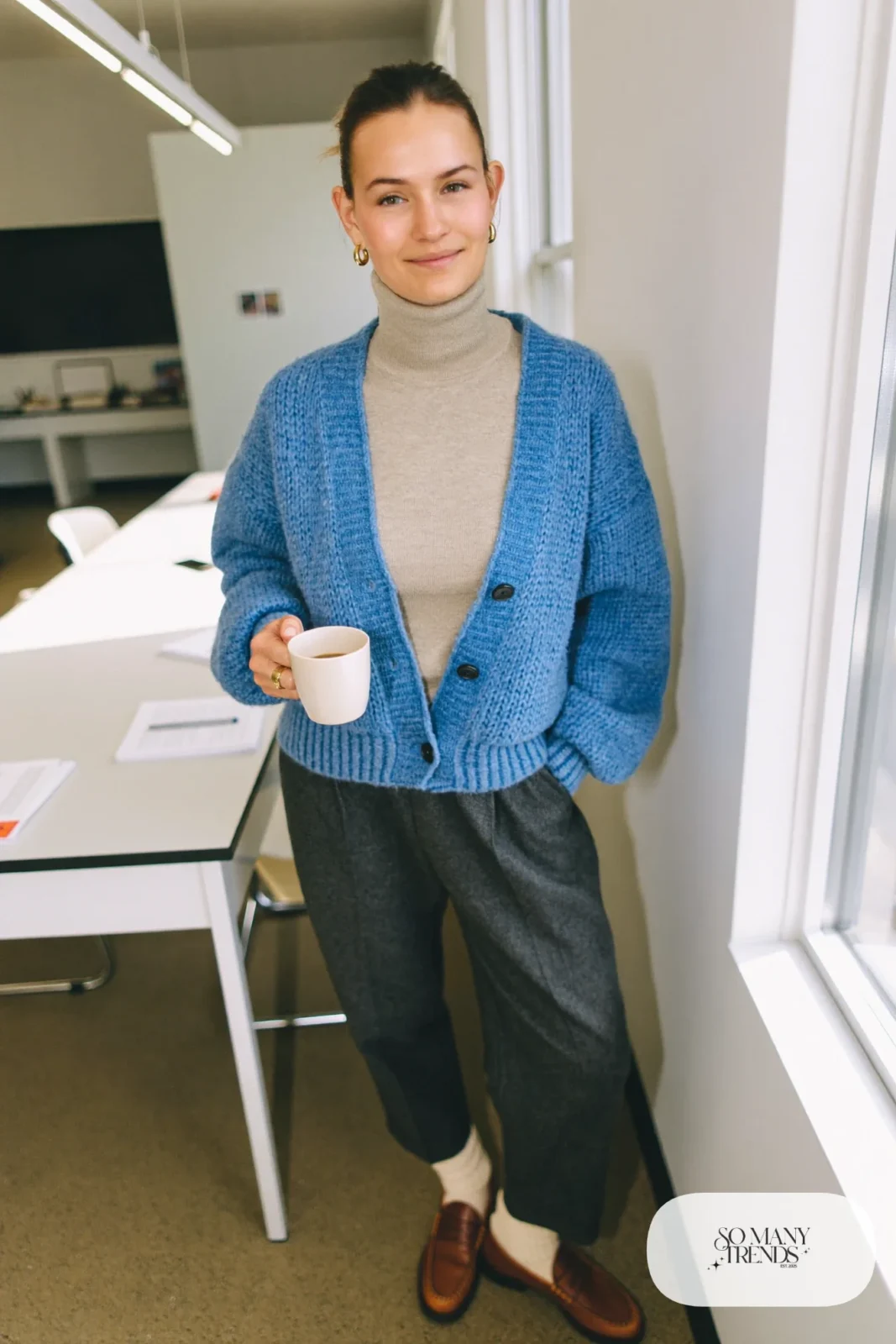 denim blue chunky cardigan oatmeal turtleneck charcoal wool trousers brown loafers socks outfit 7