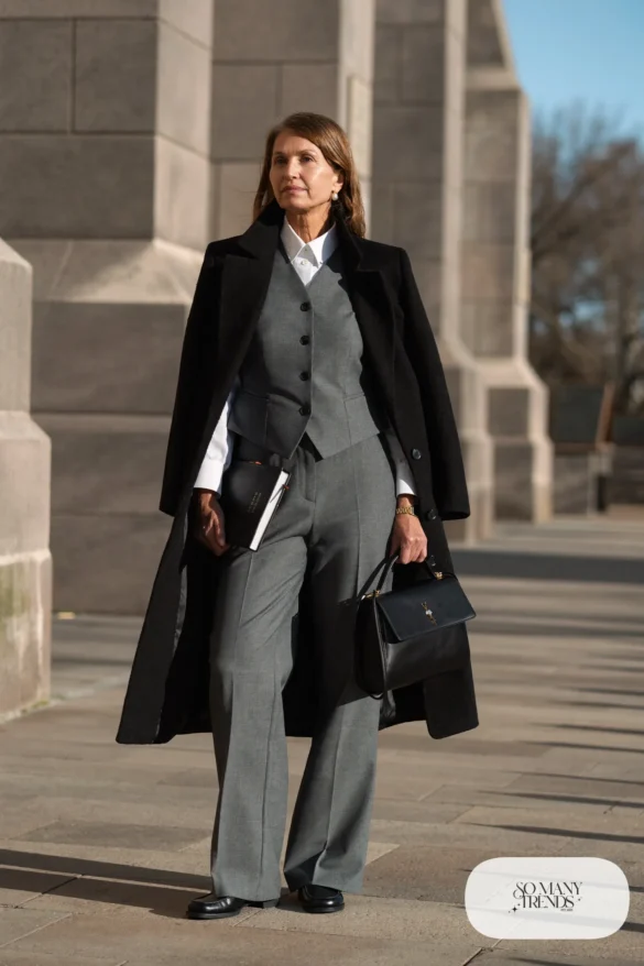 grey tailored vest white button shirt grey trousers black loafers long black coat outfit 16
