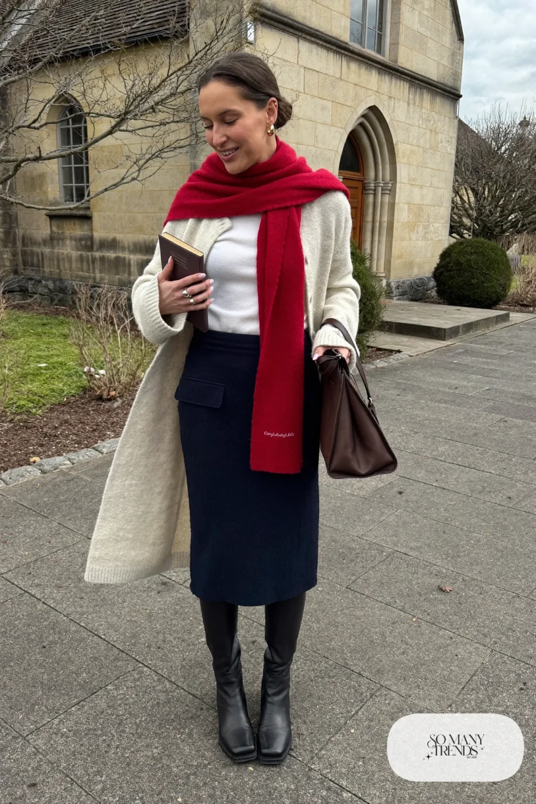 oatmeal long cardigan navy midi skirt white tee black tall boots red scarf outfit 19