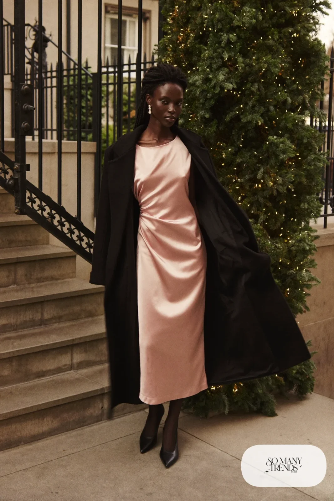 pink satin slip midi dress long black wool coat black pointed pumps sheer black tights pearl drop earrings outfit 24