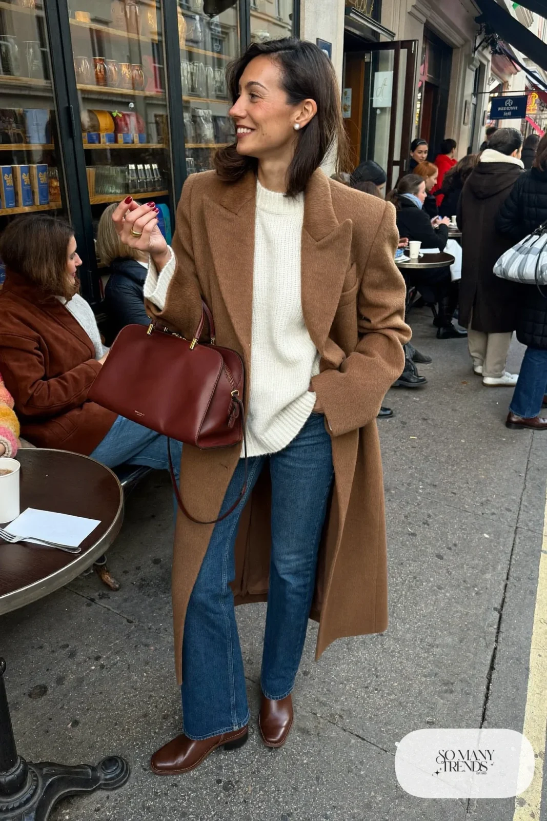 oxblood top handle bag camel coat cream knit straight jeans brown boots outfit 8
