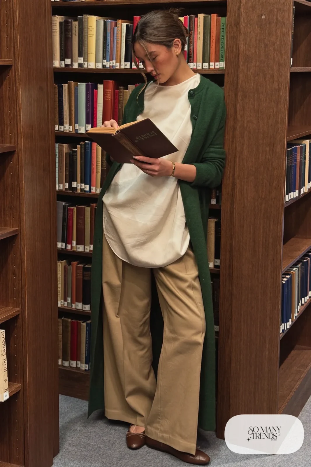 long forest green cardigan, cream silk blouse, camel pleated pants, brown leather flats, tortoiseshell hair clip, outfit 3